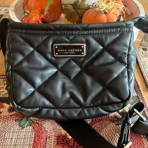 Marc Jacob’s black quilted crossbody bag.